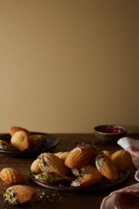 Madeleines on a plate with wall painted in Madeleine.